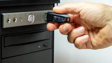 How do you insert a flash drive into a computer?